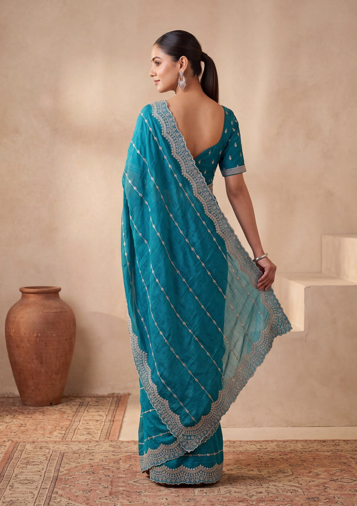 Turquoise Blue Tissue Gold Zariwork Saree With Matching Blouse Piece