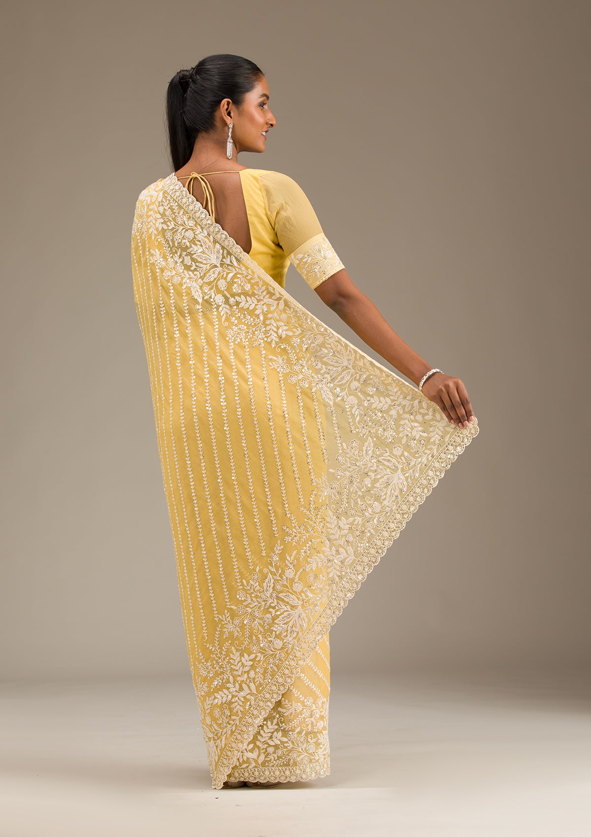 Yellow Sequins Georgette Saree