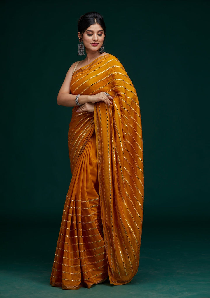 Mustard Swarovski Georgette Saree - Koskii